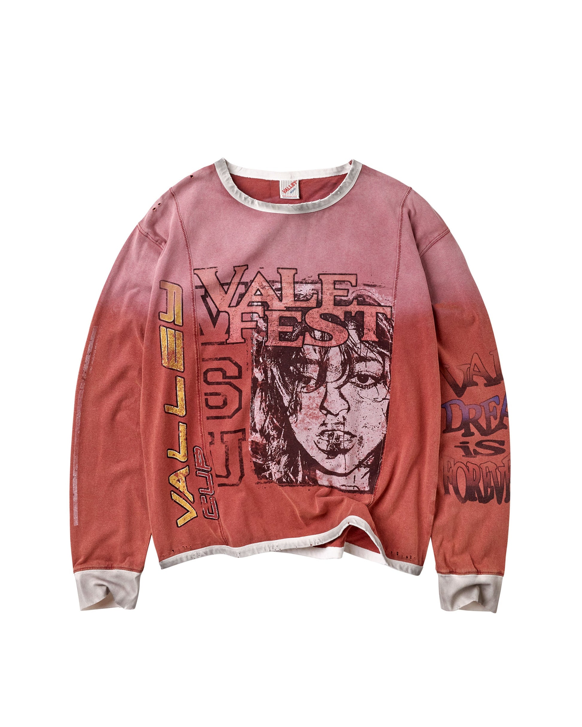 A long-sleeve crewneck sweatshirt in a washed, faded pink color, featuring a large graphic print of a woman's face and the text 'VALE FEST' on the front, with additional text on the sleeves, shown against a plain white background.