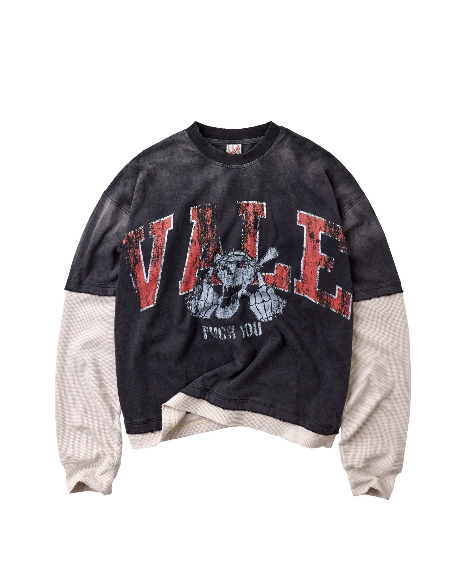 A long-sleeve graphic sweatshirt featuring a dark charcoal/black and beige color-blocked design. The front has a distressed red graphic reading 'VALE' with a skull head illustration and 'FUCK YOU' printed below it.