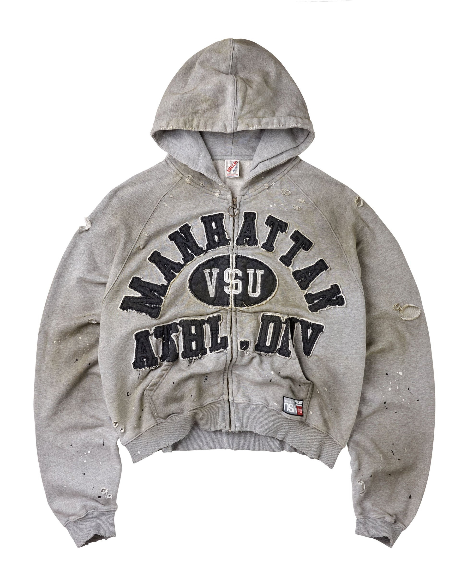A distressed light gray zip-up hoodie with 'MANHATTAN VSU ATHL. DIV' printed in black across the chest.